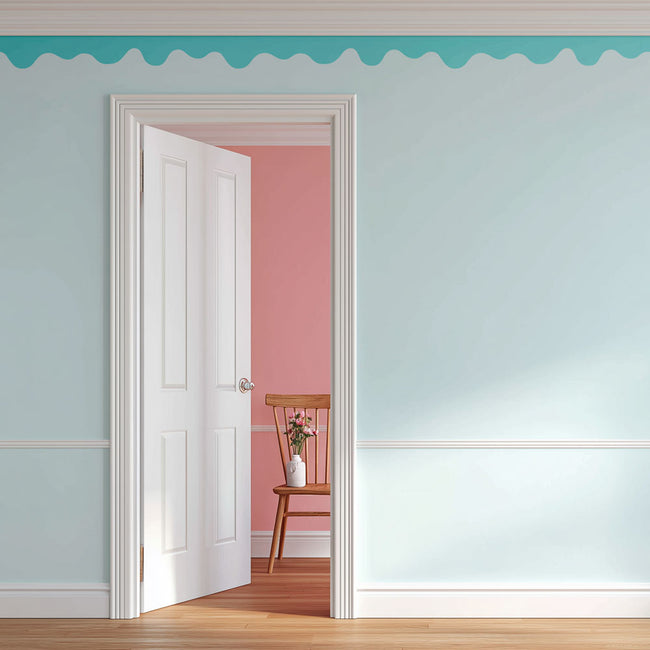 Open door leading to a room with pink walls and a wooden chair.