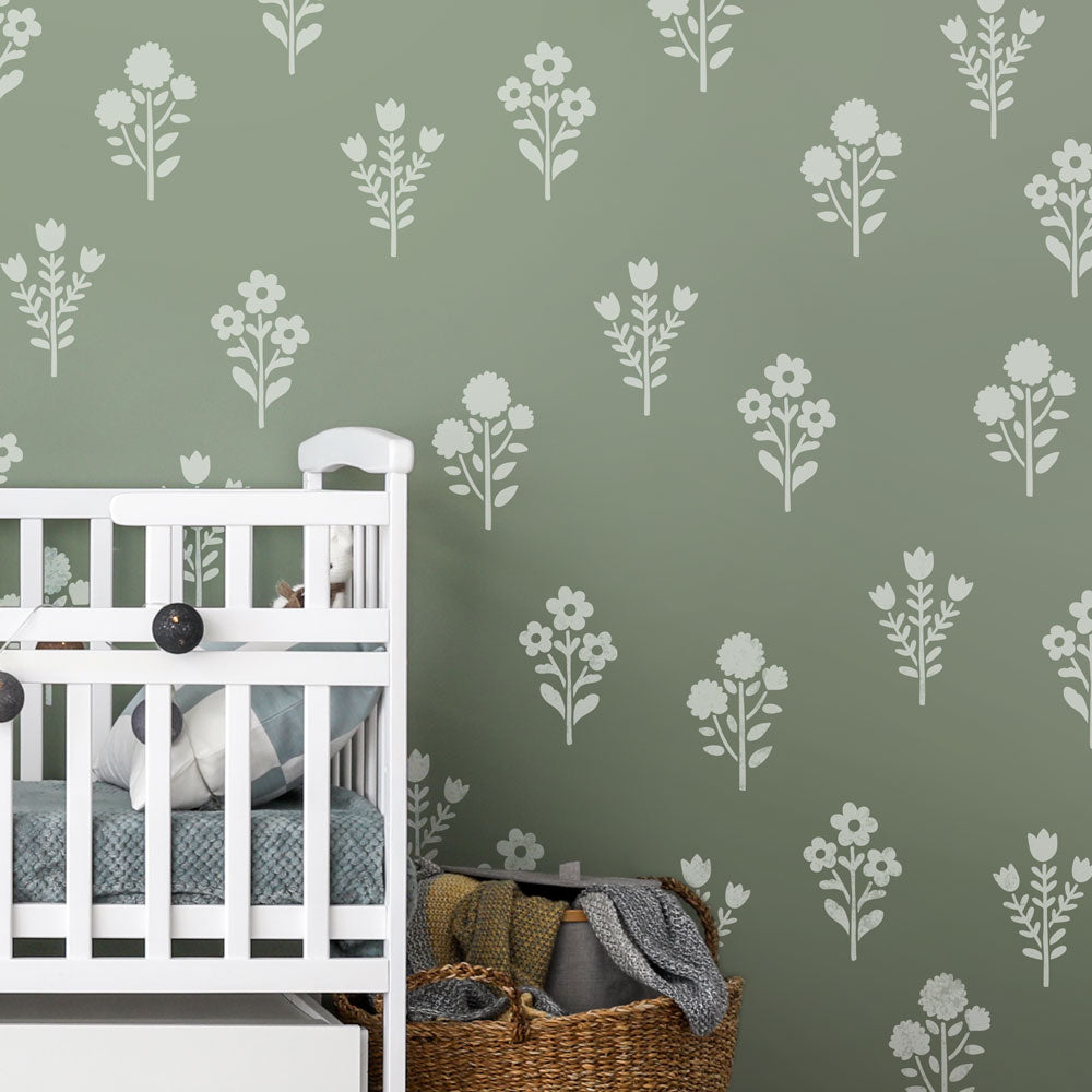 white flower kit on green wall for nursery walls stencil kit