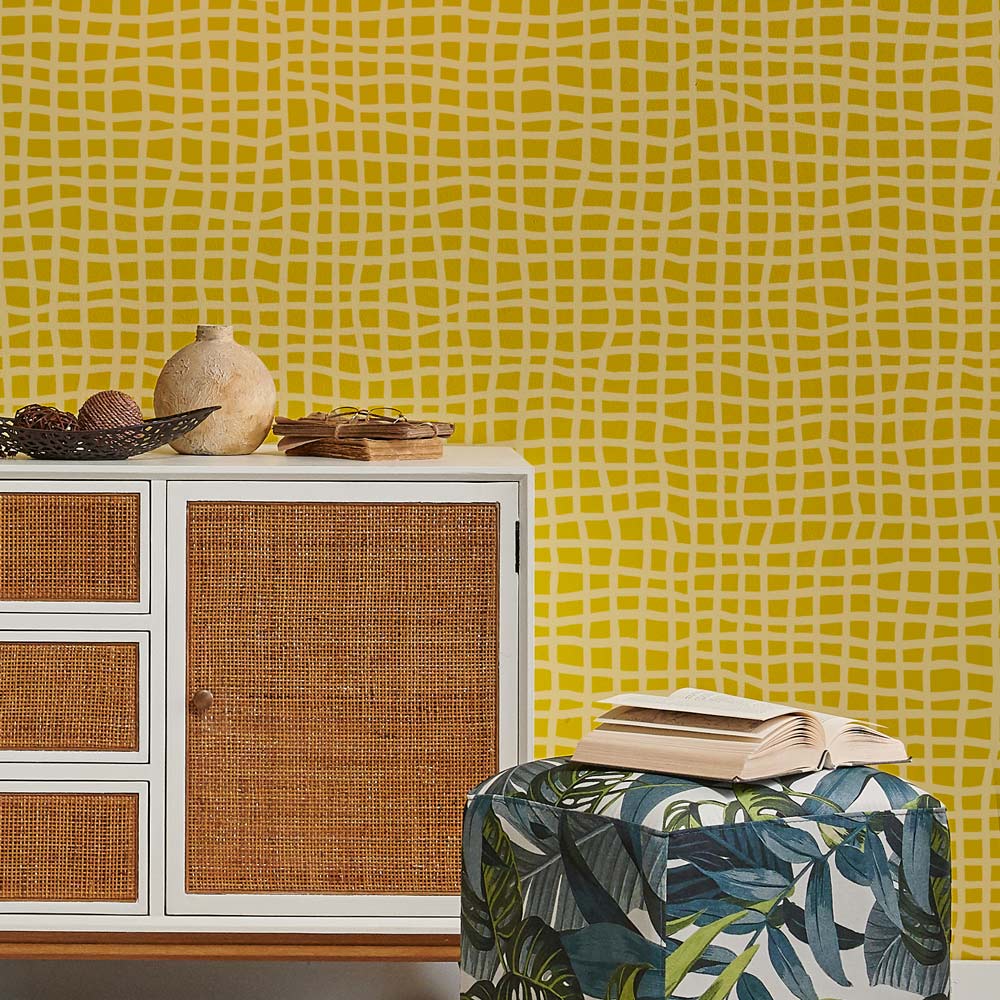 Cabinet with woven doors against a yellow patterned wall