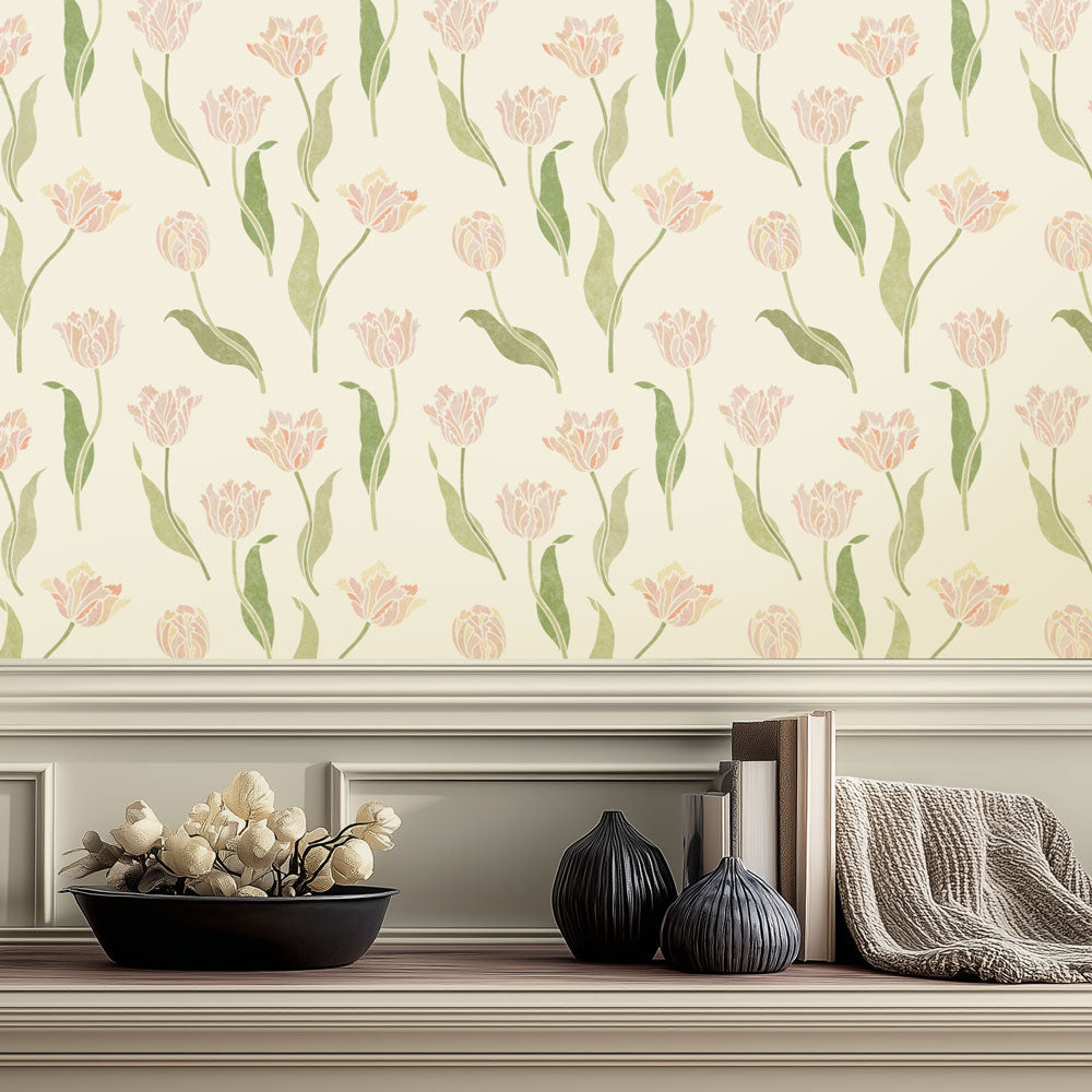 Floral wall stencil with pink tulips on a neutral background, featuring decorative items below.