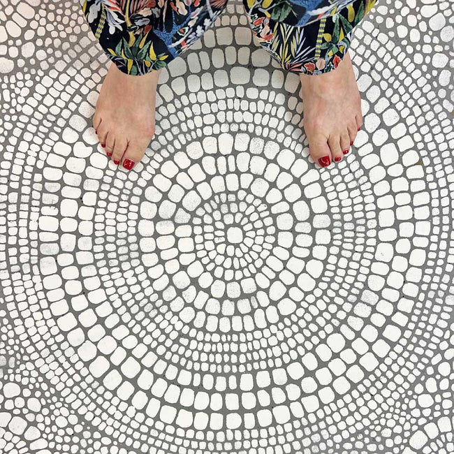 pebble patio stencil painted on concrete floor