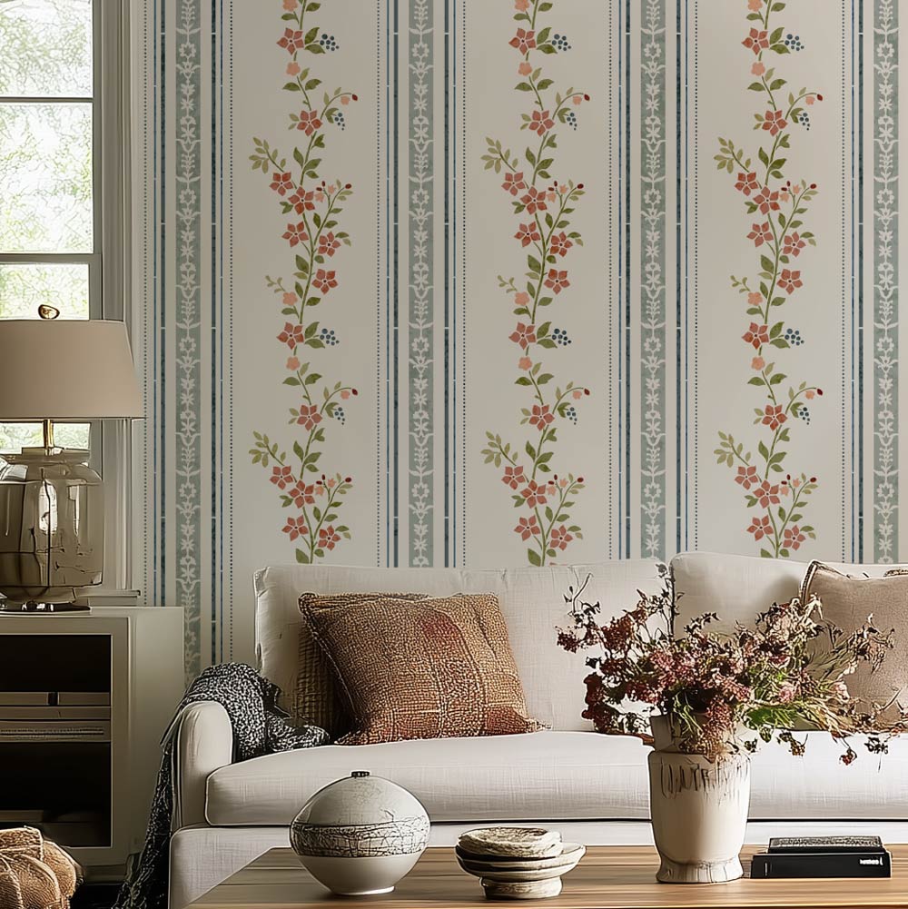 pink and blue floral living room stencil on a white wall, white sofa, and decorative pillows and vases