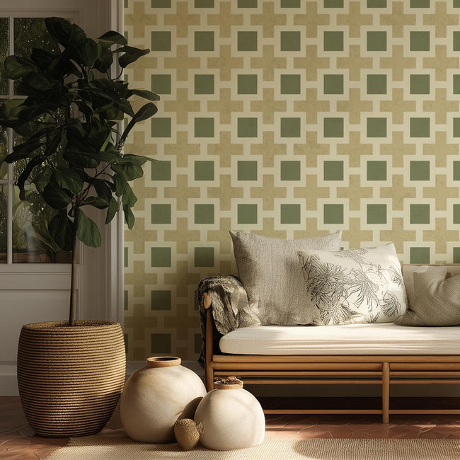 Living room with a patterned stencil wall, wooden sofa, and decorative vases.