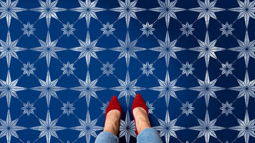 star tile stencil in white on a navy blue floor