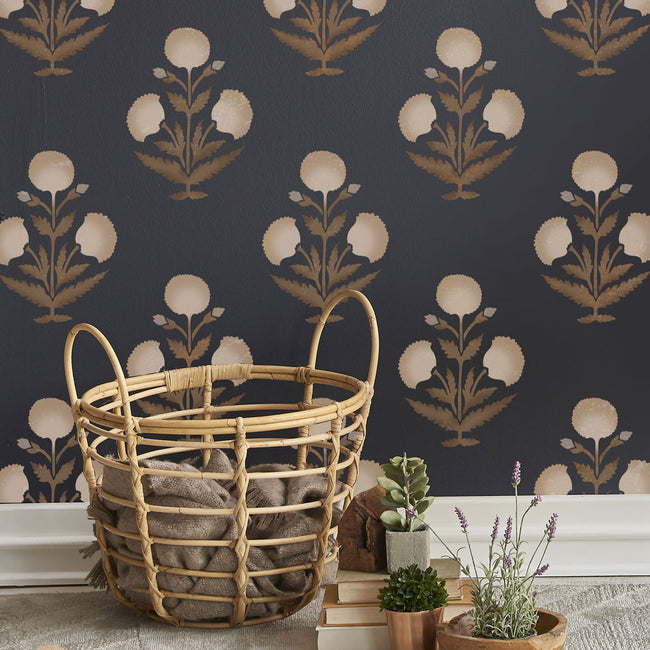 Black wall stenciled with poppy stencil