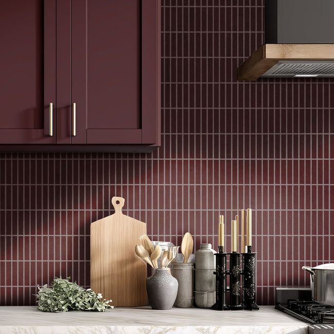 vertical rectangle stacked tile stenciled kitchen backsplash in a deep merlot color