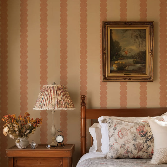 Decorative bedroom with striped wall stencil, floral lampshade, and framed painting.