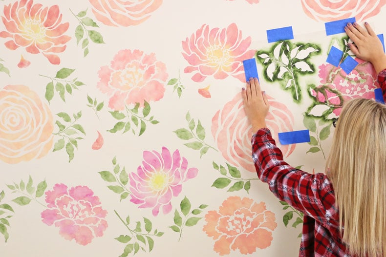 Painting over the floral wall stencil pattern
