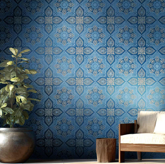Living room with blue patterned stenciling in a mediterranean style with a plant, and wooden side table.