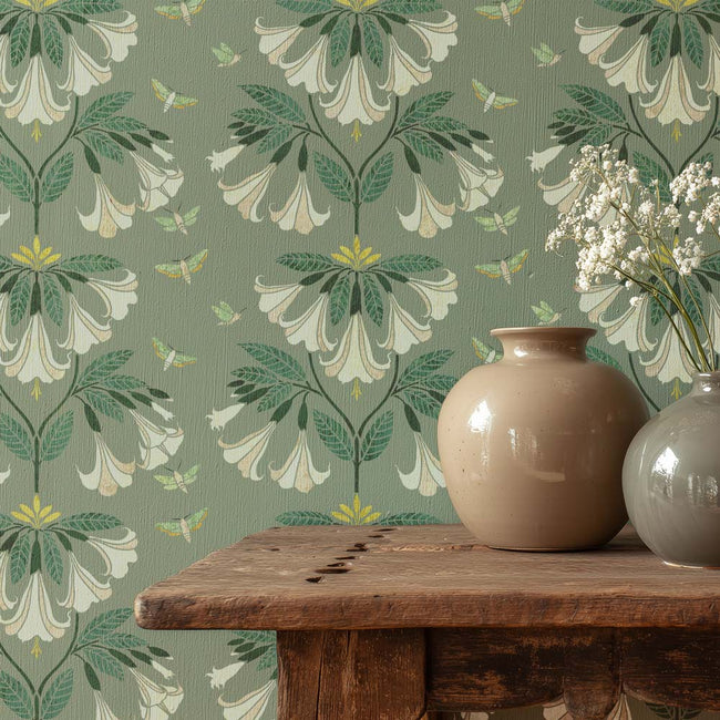 Floral wallpaper with a wooden table and two vases.