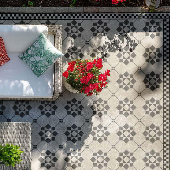 stenciled concrete patio with a checkered border