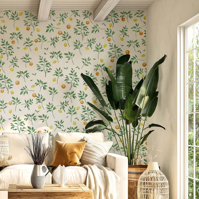Living room with citrus floral stenciling, white sofa, and decorative elements.