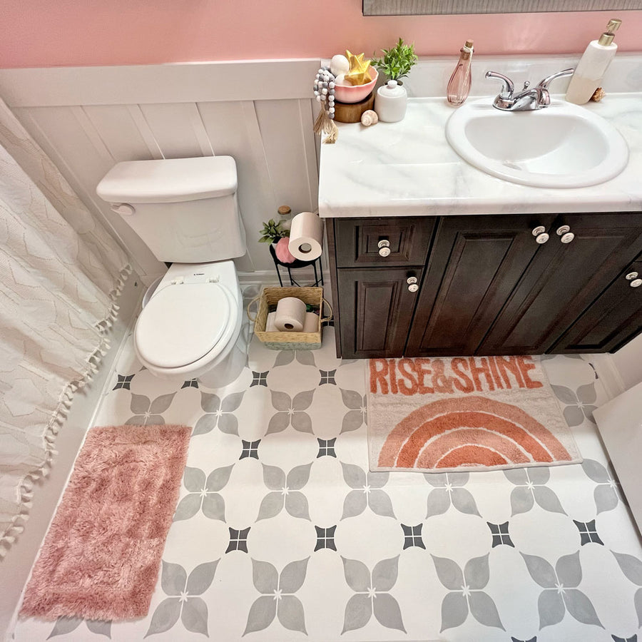 Dogwood Tile Stencil in Grey on a bathroom floor