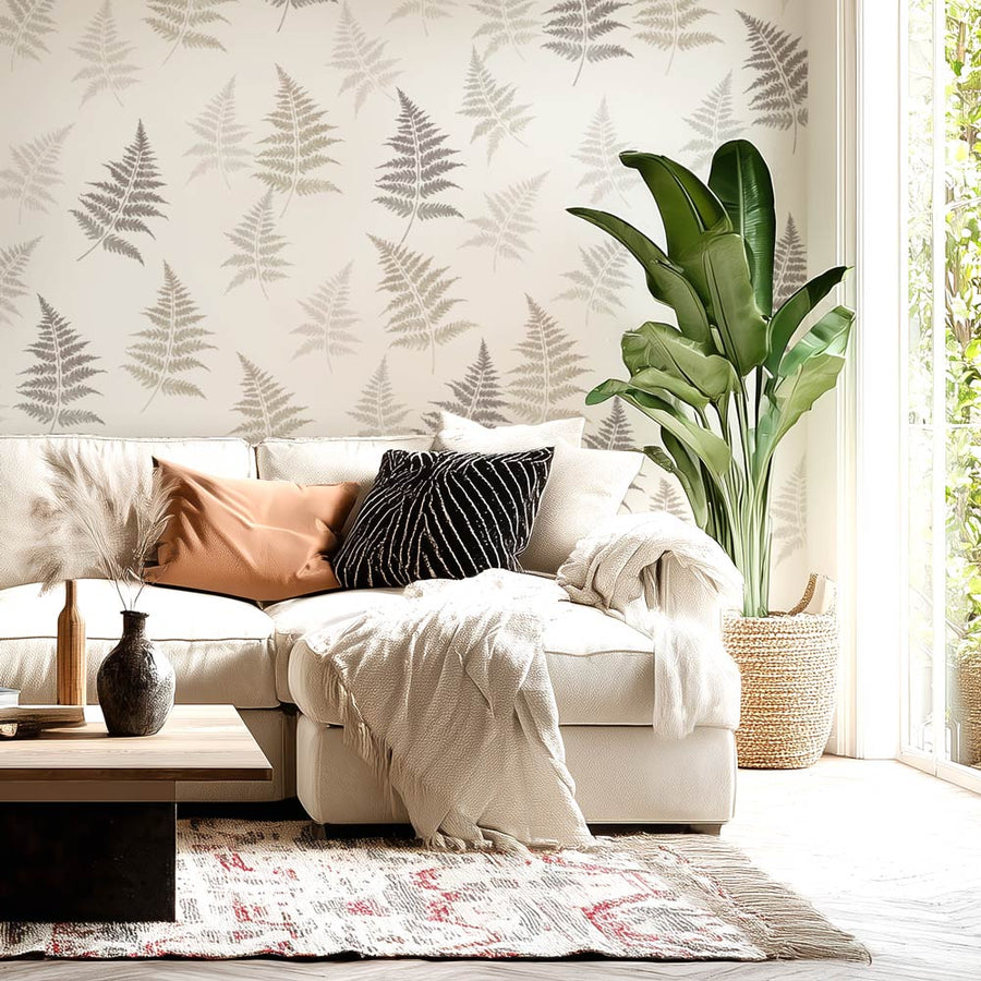 fern leaf stencils in neutral tones on a white wall

