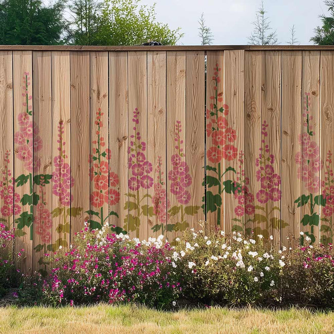 Stenciled hollyhock flowers on a wooden garden fence