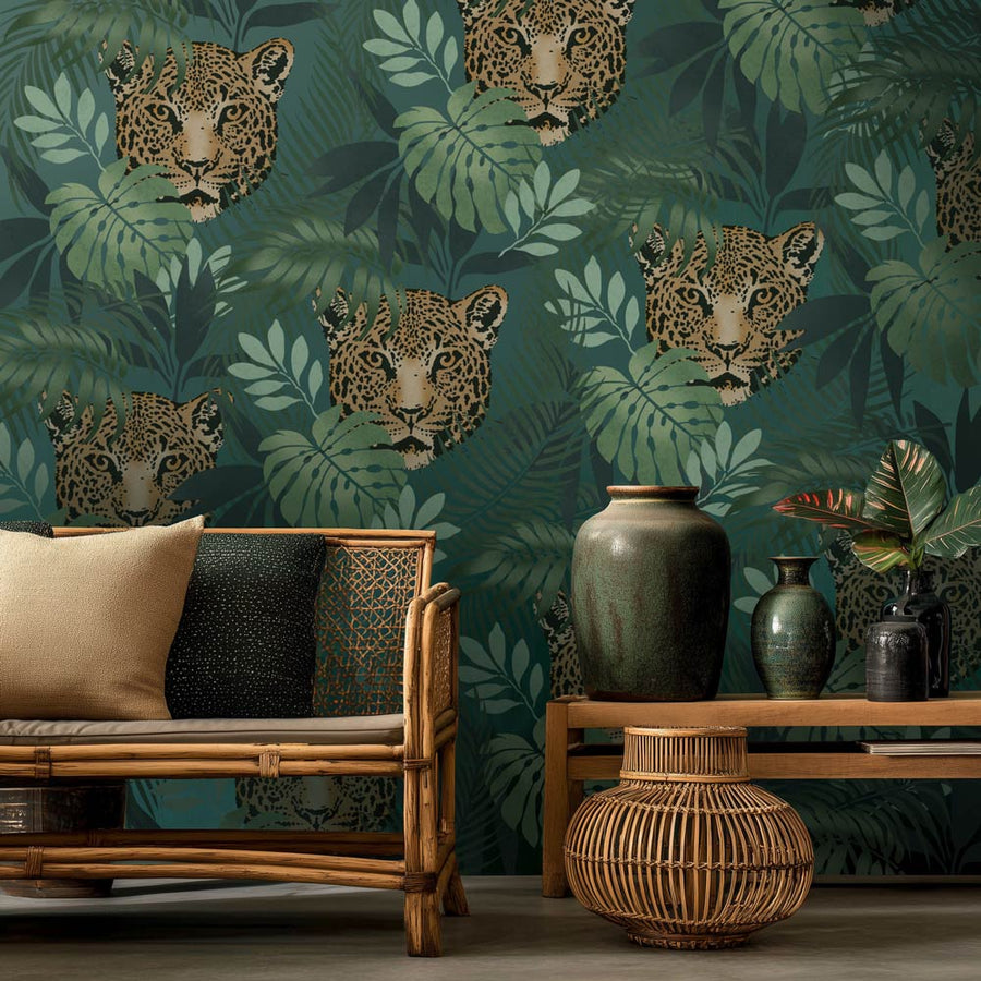 Living room with leopard and leaf stenciled wall pattern, wooden furniture, and decorative vases.