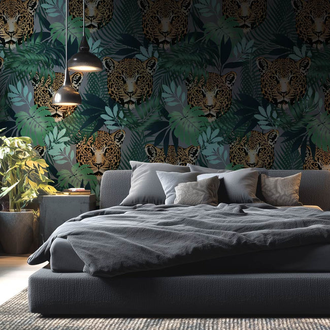 Bedroom with gray bedding and a stenciled wall featuring jaguars and jungle foliage