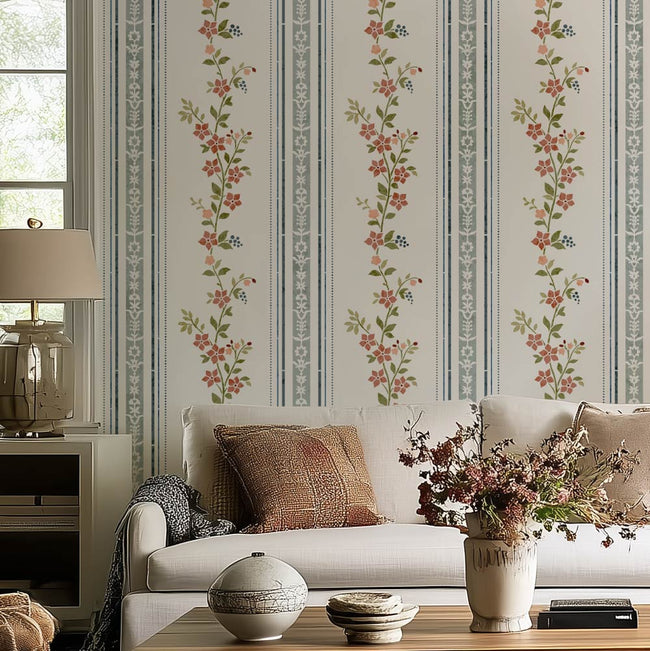 pink and blue floral living room stencil on a white wall, white sofa, and decorative pillows and vases