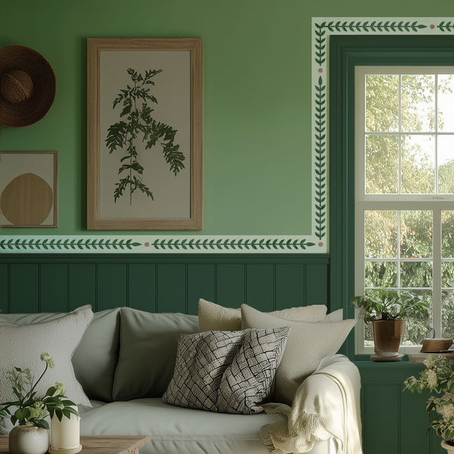 Rosemary trim border stencil above a chair rail on a green wall
