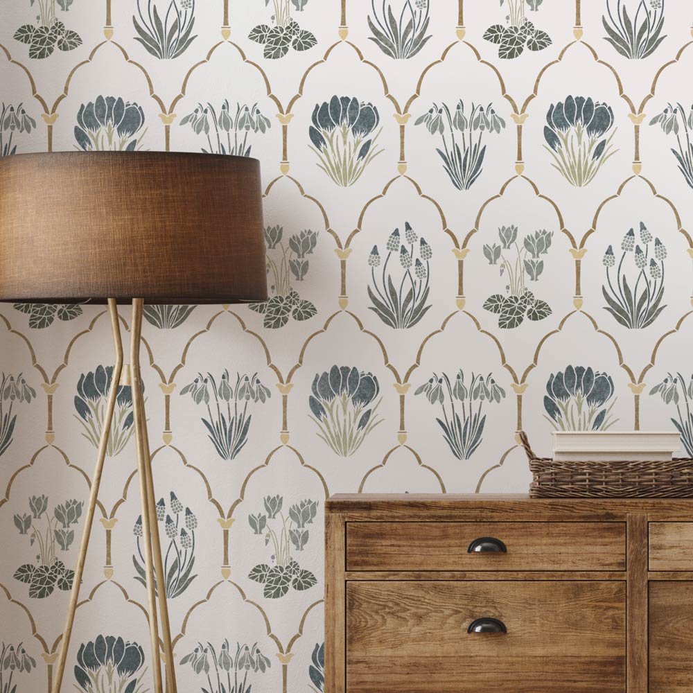 Decorative wall stencil with geometric spring floral pattern and wooden furniture.