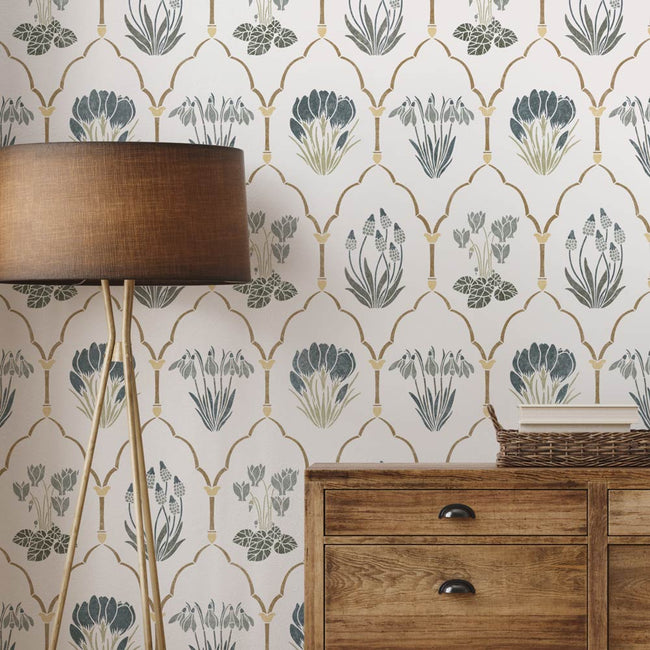 Decorative wall stencil with geometric spring floral pattern and wooden furniture.
