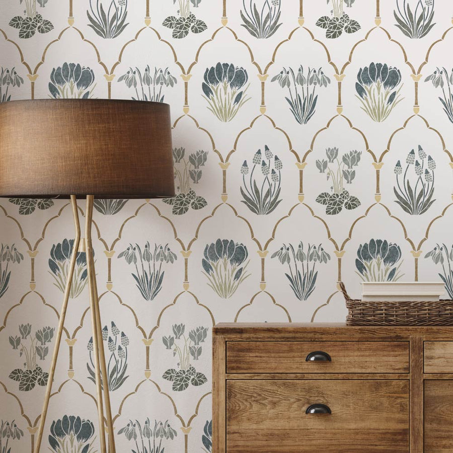 Decorative wall stencil with geometric spring floral pattern and wooden furniture.