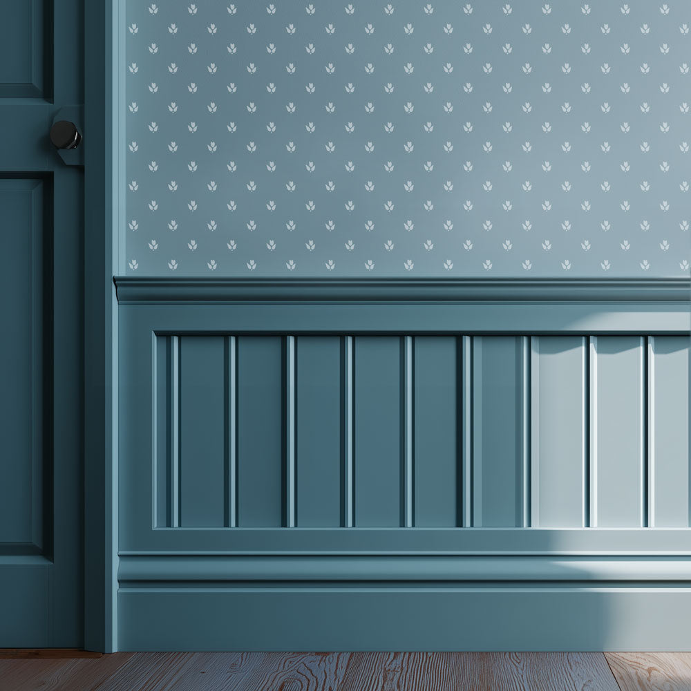 Wall with decorative paneling and patterned tiny tulip wall stencil