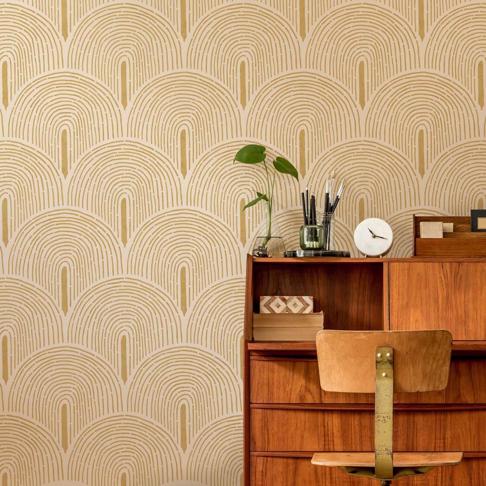 Wooden dresser against a wall with geometric stencil pattern