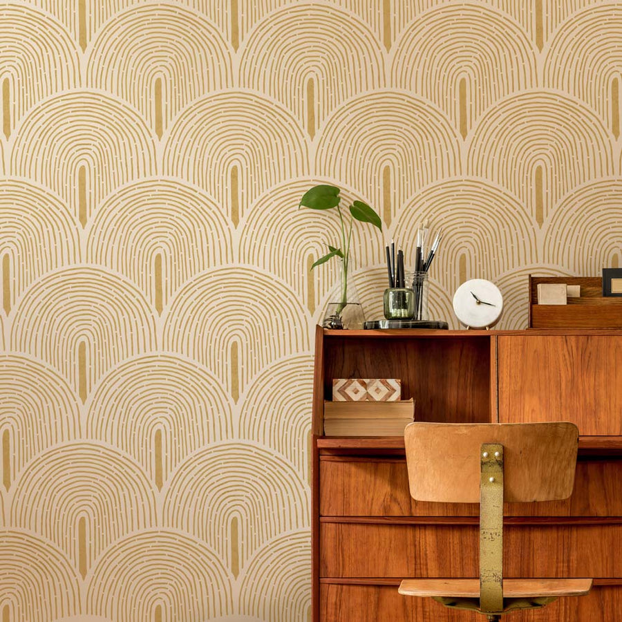 Wooden dresser against a wall with geometric stencil pattern