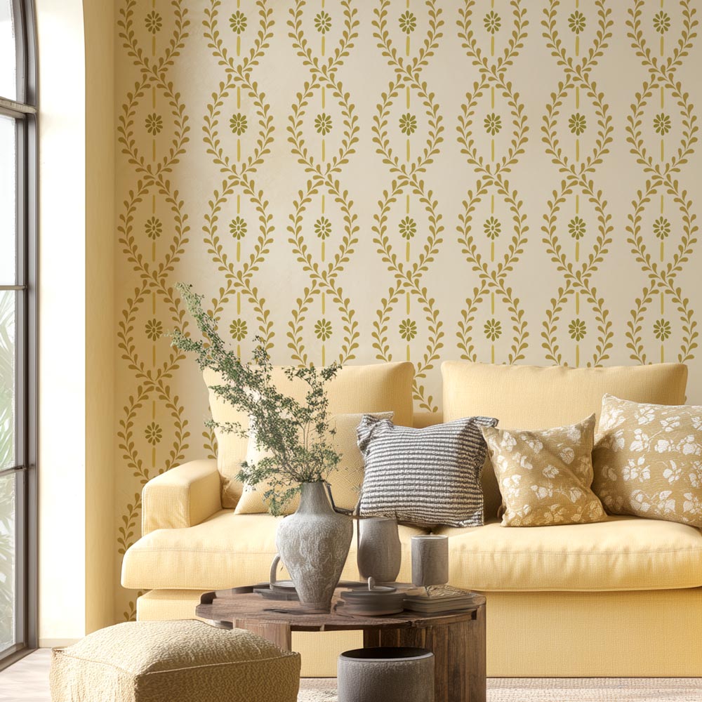 Cottage style stencil pattern in a yellow living room with mustard yellow wall stencil with yellow couch and pillows