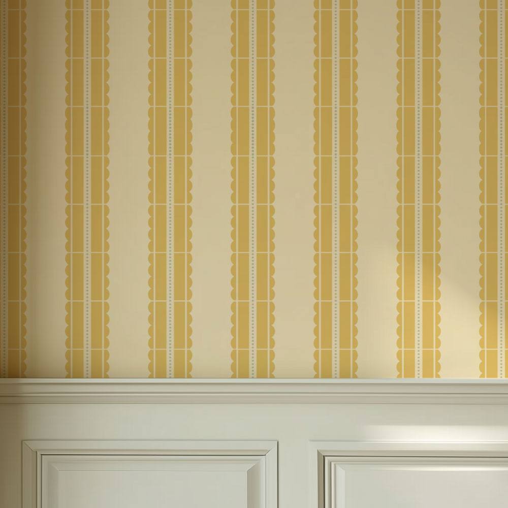 Striped wallpaper with gold and beige stencil pattern on a wall above a white cabinet.