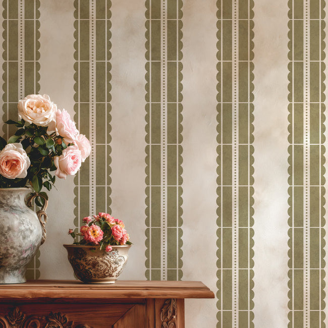 Decorative wall stencil with vertical stripes and a wooden console table with floral arrangements.