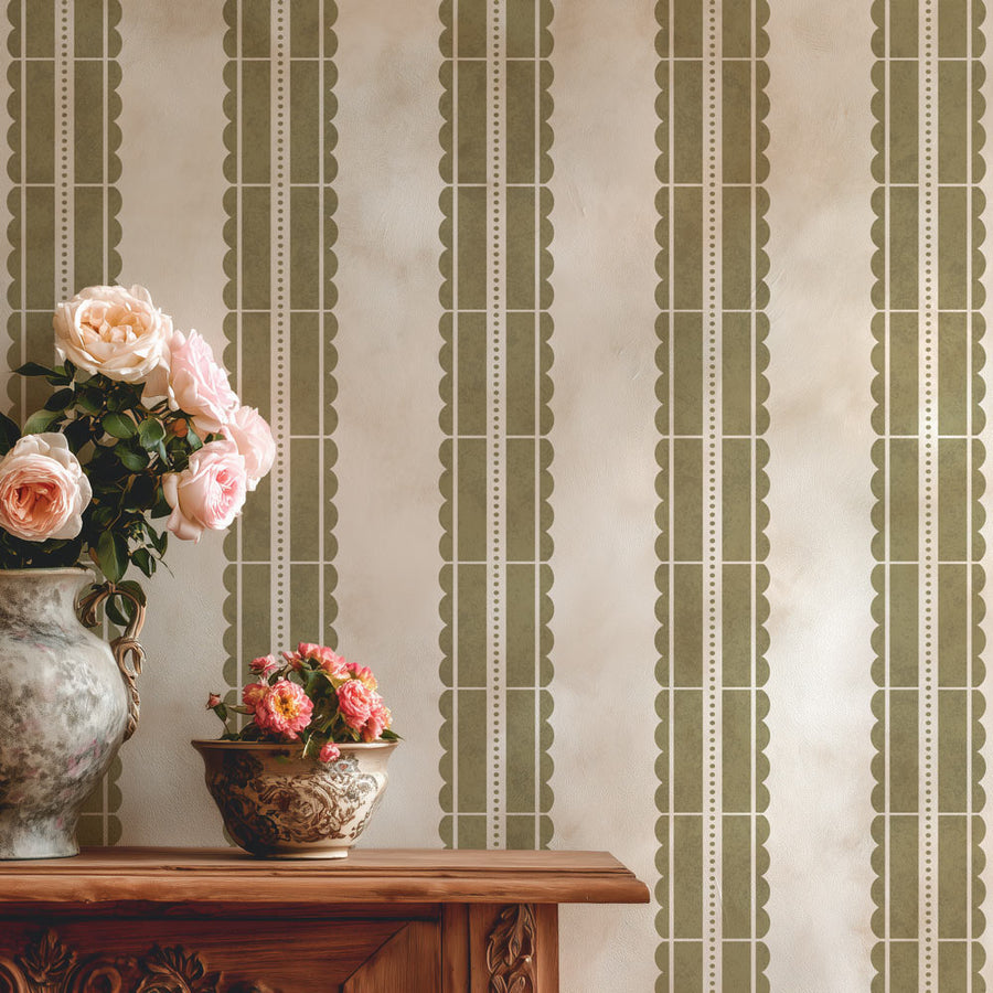 Decorative wall stencil with vertical stripes and a wooden console table with floral arrangements.