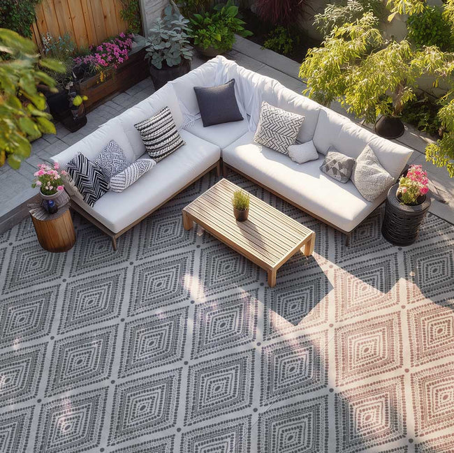 pebble diamond patio stencil featured on a concrete patio with outdoor furniture