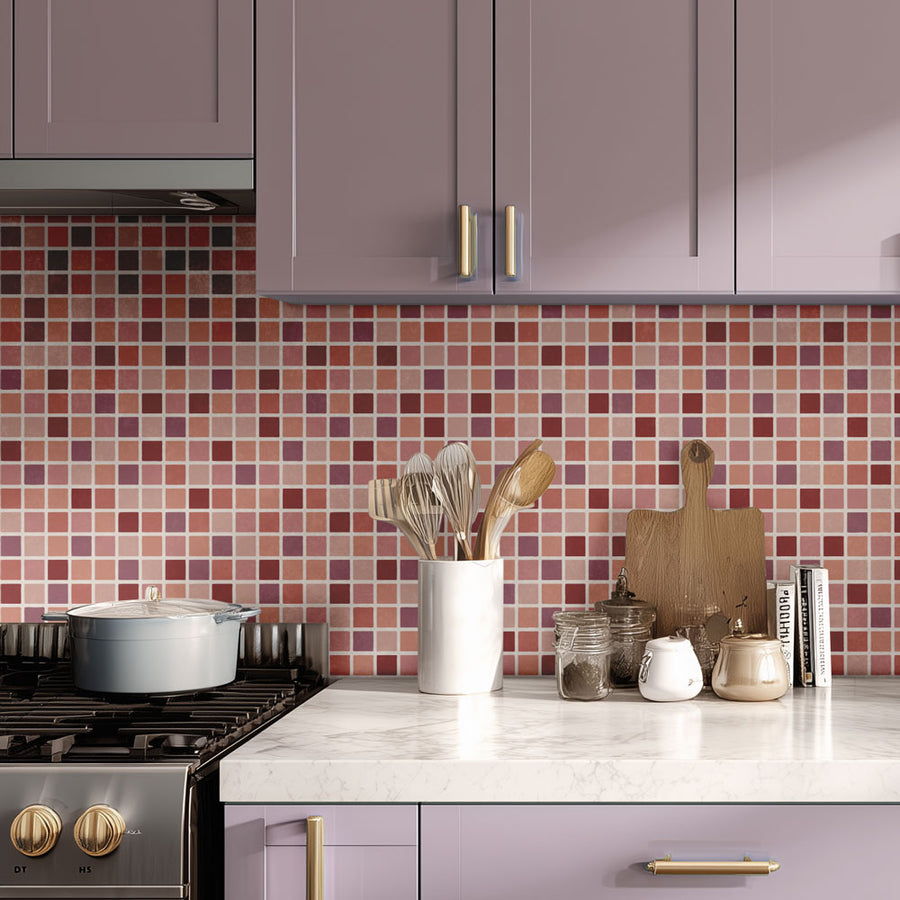 Modern kitchen with purple cabinets, stenciled mosaic tile backsplash, and various kitchen utensils on the counter.