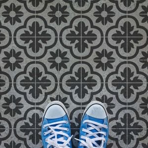 Cement tile floor stenciled design